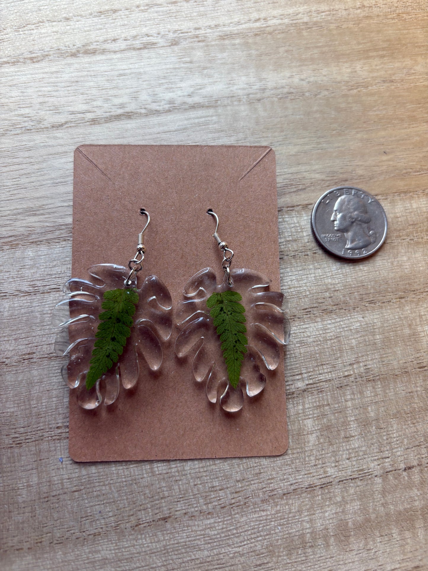 Ferns inside of monstera shape earrings